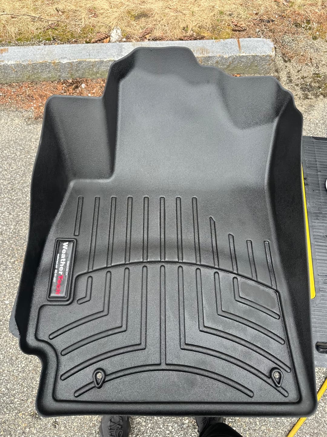 Car floor mats after professional interior detailing and deep cleaning