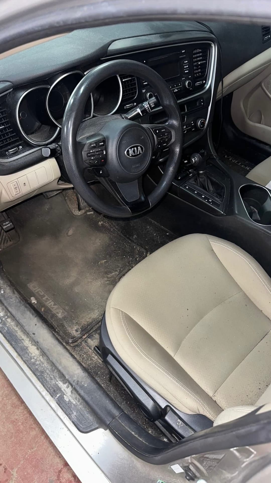 Leather car seat before interior detailing with visible wear and dirt